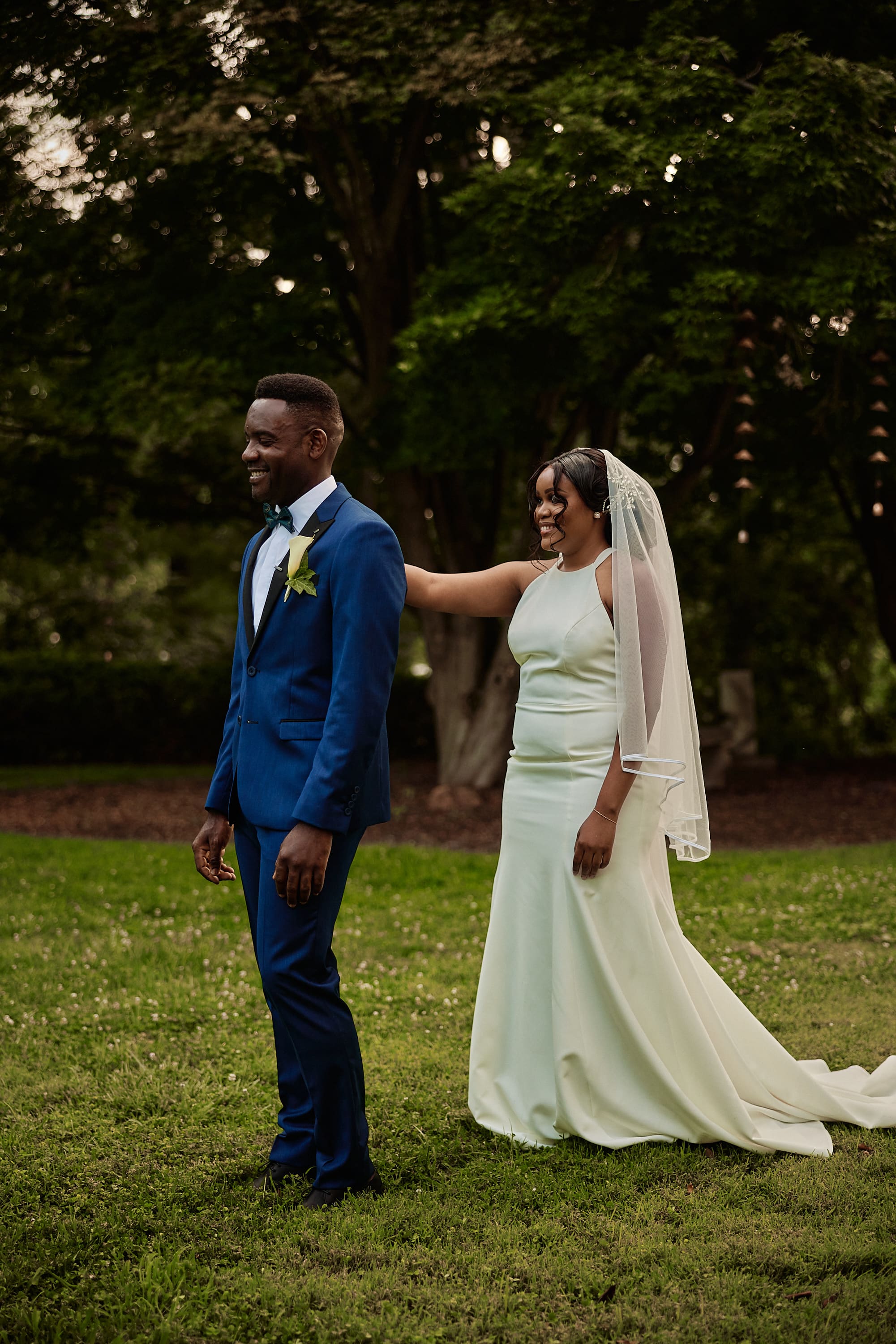 Candid photo of a couple during their wedding ceremony in a park